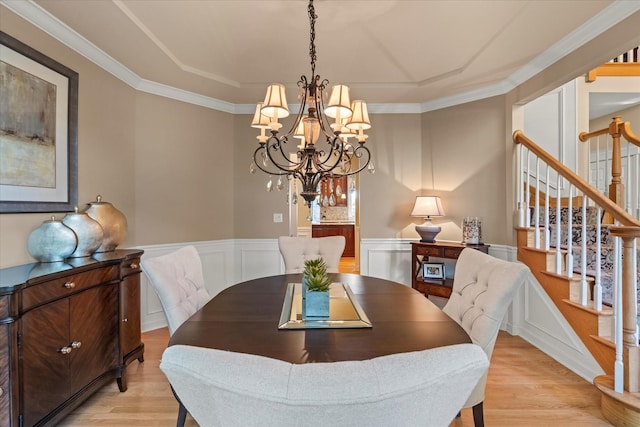 1396 Notre Dame Dr, Lemont, IL 60439 - dining space with light wood finished floors, stairs, a chandelier, ornamental molding, and a wainscoted wall