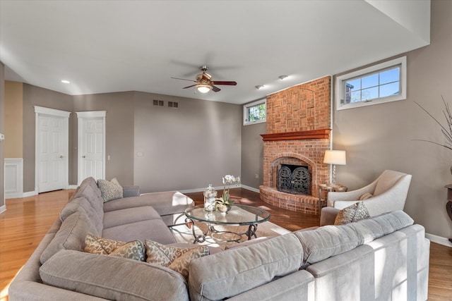 1396 Notre Dame Dr, Lemont, IL 60439 - living area with a fireplace, a ceiling fan, and light wood-style flooring