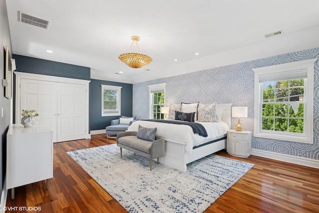 2236 Birchwood Ave, Wilmette, IL 60091 - bedroom with wallpapered walls, wood finished floors, recessed lighting, and an accent wall