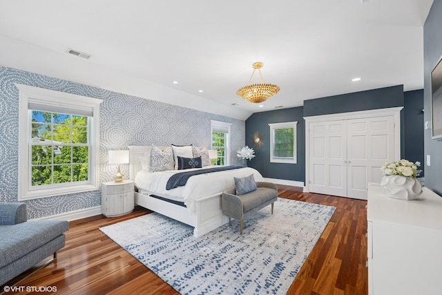 2236 Birchwood Ave, Wilmette, IL 60091 - bedroom with wallpapered walls, an accent wall, a closet, dark wood-type flooring, and recessed lighting