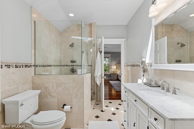 2236 Birchwood Ave, Wilmette, IL 60091 - ensuite bathroom with tile walls, tiled shower, vanity, tile patterned floors, and wainscoting