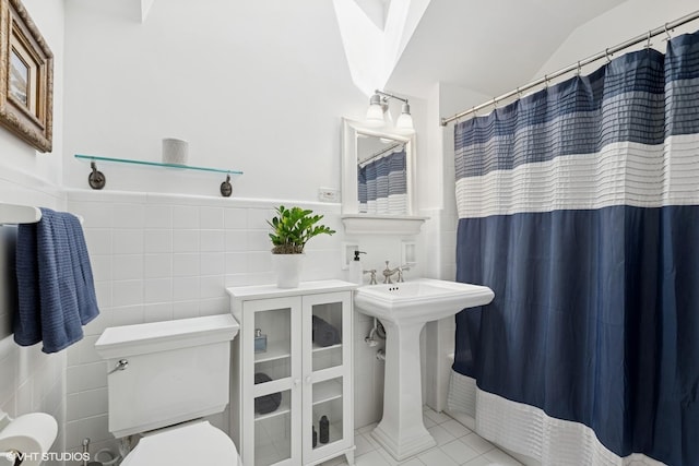 2236 Birchwood Ave, Wilmette, IL 60091 - full bath with tile walls, a shower with curtain, tile patterned floors, and a wainscoted wall