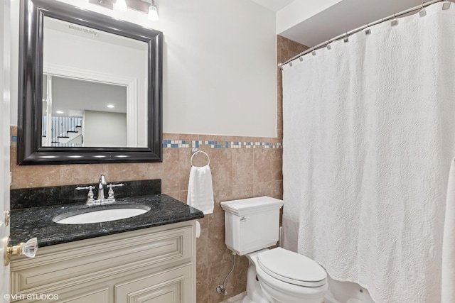 2236 Birchwood Ave, Wilmette, IL 60091 - full bath with tile walls, vanity, wainscoting, and a shower with curtain