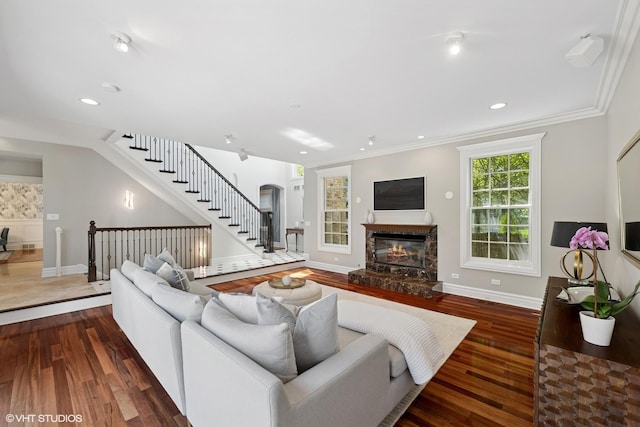 2236 Birchwood Ave, Wilmette, IL 60091 - living area with wood finished floors, arched walkways, a glass covered fireplace, stairway, and recessed lighting