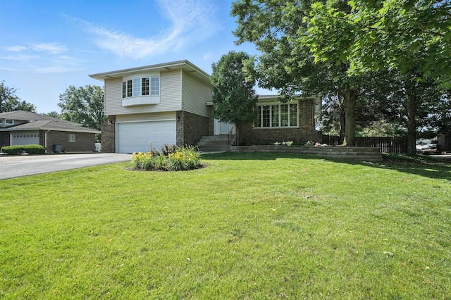 7855 Silver Ct, Orland Park, IL 60462 - tri-level home with brick siding, asphalt driveway, and an attached garage