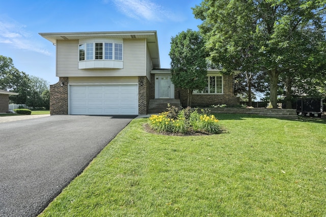 7855 Silver Ct, Orland Park, IL 60462 - split level home featuring brick siding, driveway, a front yard, and an attached garage