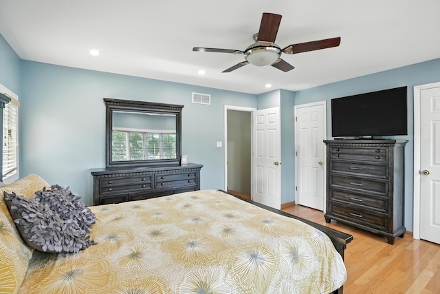 7855 Silver Ct, Orland Park, IL 60462 - bedroom featuring multiple windows, wood finished floors, recessed lighting, and a ceiling fan