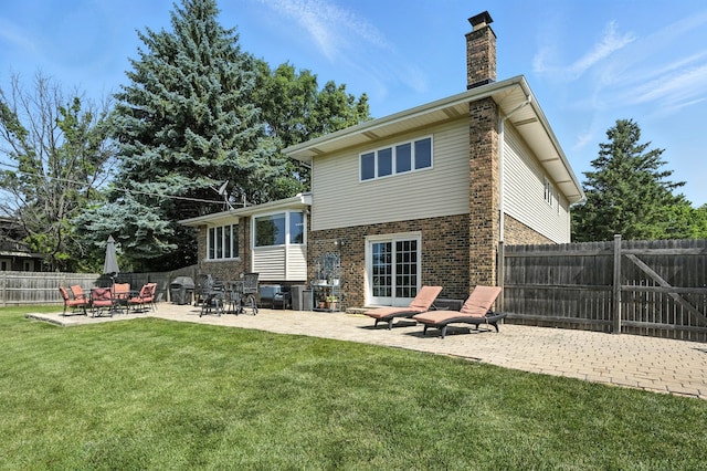 7855 Silver Ct, Orland Park, IL 60462 - back of property featuring a patio, a chimney, brick siding, and a fenced backyard