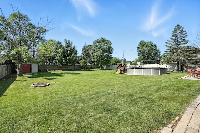 7855 Silver Ct, Orland Park, IL 60462 - fenced backyard featuring an outdoor fire pit and a shed