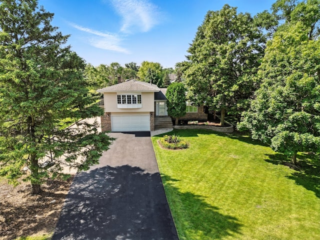 7855 Silver Ct, Orland Park, IL 60462 - view of front of property with asphalt driveway, an attached garage, brick siding, and a front yard
