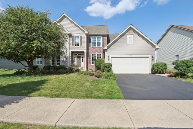1128 Teasel Ln, Naperville, IL 60564 - traditional-style home with driveway, a front lawn, a garage, and brick siding