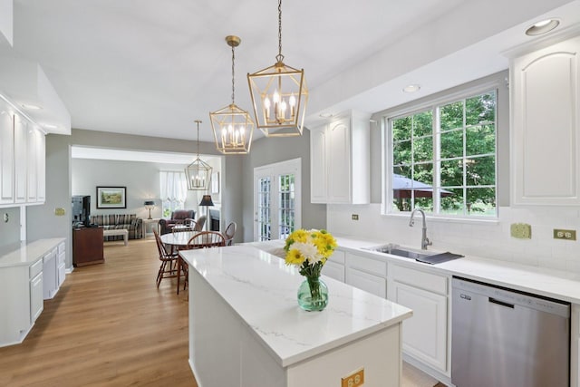 1128 Teasel Ln, Naperville, IL 60564 - kitchen with stainless steel dishwasher, a kitchen island, backsplash, open floor plan, and recessed lighting