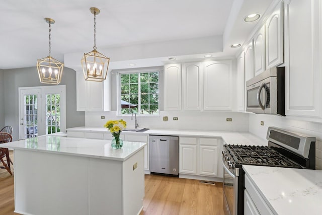 1128 Teasel Ln, Naperville, IL 60564 - kitchen featuring stainless steel appliances, backsplash, a chandelier, light wood finished floors, and recessed lighting