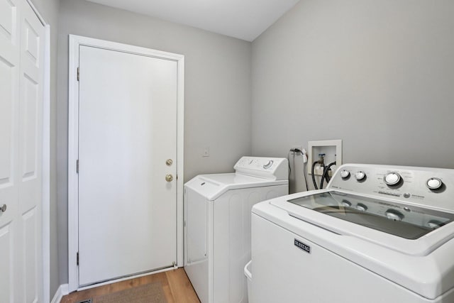 1128 Teasel Ln, Naperville, IL 60564 - washroom featuring independent washer and dryer and wood finished floors