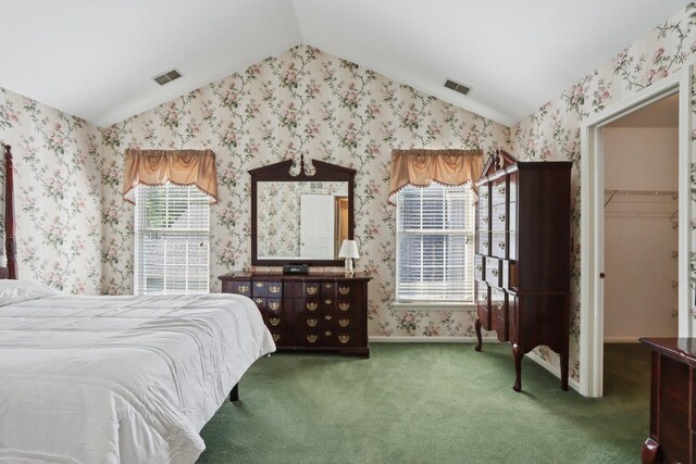 1128 Teasel Ln, Naperville, IL 60564 - bedroom featuring lofted ceiling, wallpapered walls, carpet floors, and a walk in closet