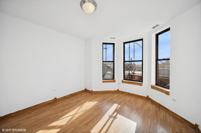 1756 W 35th St Unit 3F, Chicago, IL 60609 - empty room with wood finished floors and baseboards