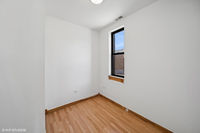 1756 W 35th St Unit 3F, Chicago, IL 60609 - spare room featuring light wood-style flooring and baseboards