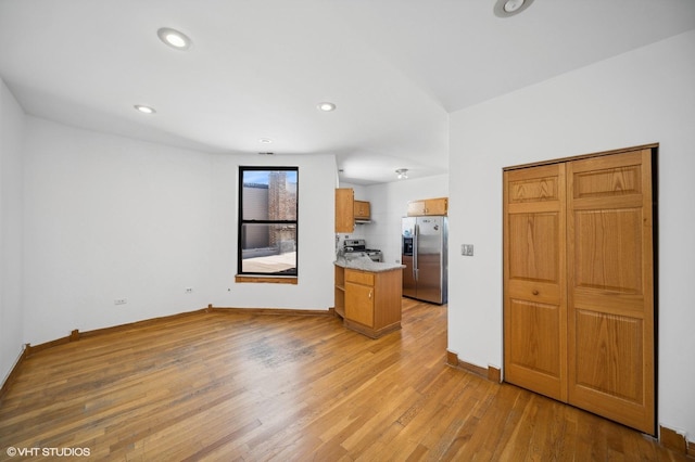 1756 W 35th St Unit 3F, Chicago, IL 60609 - kitchen featuring appliances with stainless steel finishes, light wood-style floors, light countertops, brown cabinets, and recessed lighting