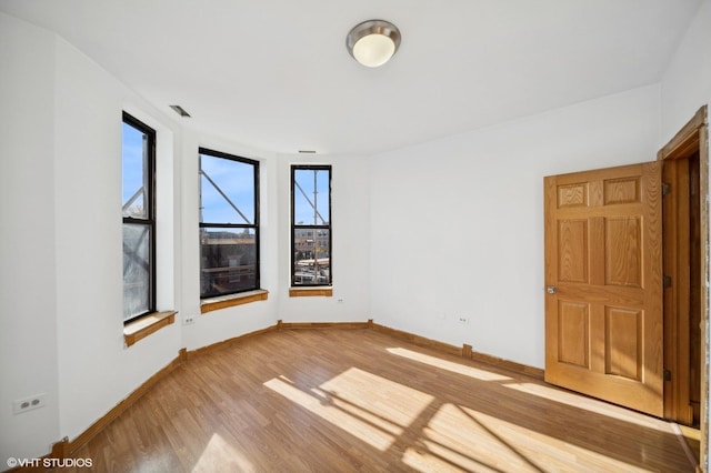 1756 W 35th St Unit 3F, Chicago, IL 60609 - empty room with wood finished floors and baseboards