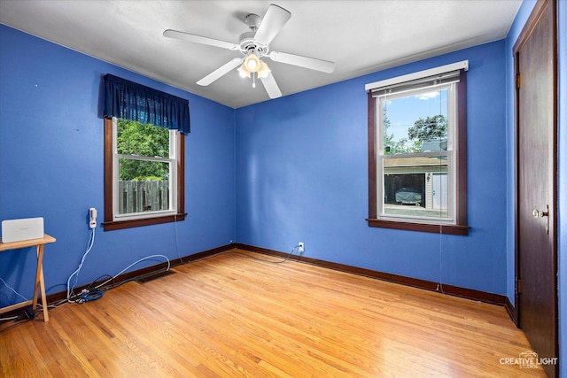1165 Morton Ave, Elgin, IL 60120 - empty room with wood finished floors and ceiling fan