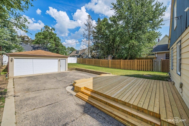 1165 Morton Ave, Elgin, IL 60120 - wooden terrace with a detached garage and an outbuilding