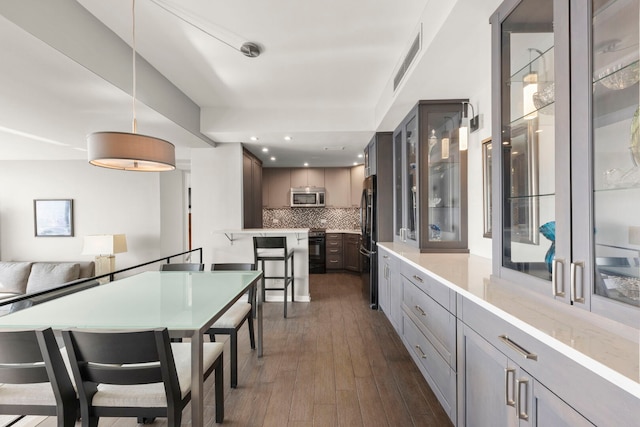 3200 N Lake Shore Dr N Unit 1910, Chicago, IL 60657 - dining area with dark wood-style floors and recessed lighting