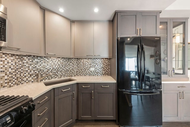 3200 N Lake Shore Dr N Unit 1910, Chicago, IL 60657 - kitchen with black appliances, light countertops, decorative backsplash, recessed lighting, and gray cabinetry