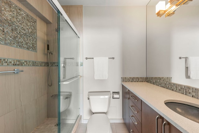 3200 N Lake Shore Dr N Unit 1910, Chicago, IL 60657 - bathroom featuring vanity, a shower stall, and decorative backsplash