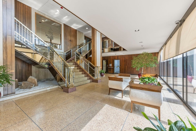 3200 N Lake Shore Dr N Unit 1910, Chicago, IL 60657 - lobby with wood walls, stairway, recessed lighting, and a high ceiling