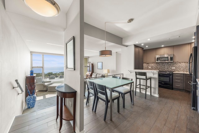 3200 N Lake Shore Dr N Unit 1910, Chicago, IL 60657 - dining area featuring dark wood-type flooring and recessed lighting