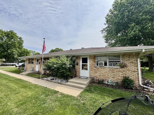 1526 Douglas Ct, Belvidere, IL 61008 - ranch-style house with a front yard and brick siding