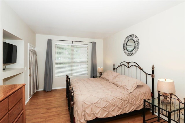 768 W St Johns Pl, Addison, IL 60101 - bedroom with light wood-style floors and baseboards