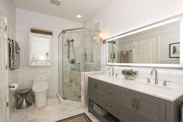 768 W St Johns Pl, Addison, IL 60101 - full bathroom with tile walls, a shower stall, double vanity, and marble finish flooring