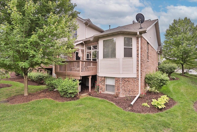 768 W St Johns Pl, Addison, IL 60101 - rear view of house with brick siding, a lawn, and a wooden deck