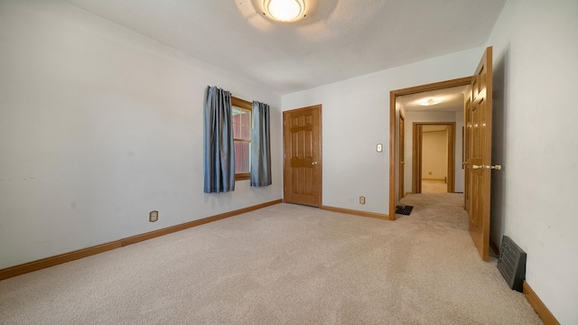931 C St, Rockford, IL 61107 - spare room with light carpet