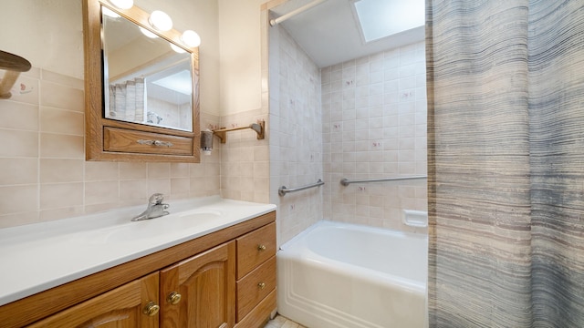 931 C St, Rockford, IL 61107 - full bath with tile walls, vanity, and shower / tub combo with curtain