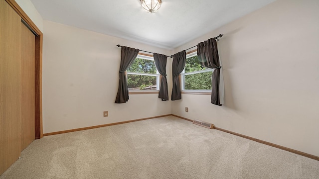931 C St, Rockford, IL 61107 - unfurnished room featuring carpet floors