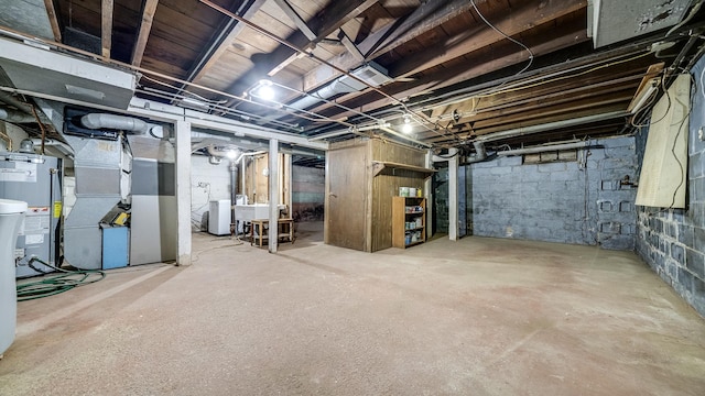 931 C St, Rockford, IL 61107 - unfinished basement featuring heating unit and gas water heater