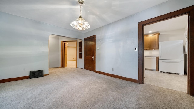 931 C St, Rockford, IL 61107 - unfurnished room with light colored carpet and arched walkways