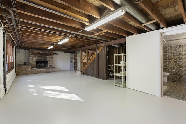 14545 Laporte Ave, Midlothian, IL 60445 - basement with stairs and a brick fireplace