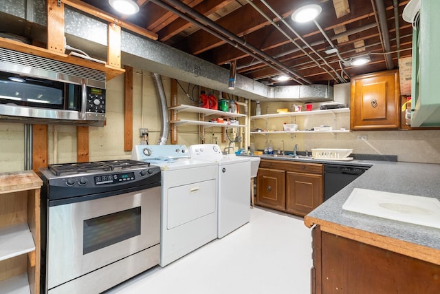 14545 Laporte Ave, Midlothian, IL 60445 - kitchen featuring stainless steel appliances, open shelves, independent washer and dryer, finished concrete floors, and brown cabinetry