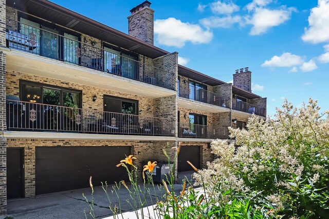 1640 Royal Oak Rd Unit 4, Darien, IL 60561 - view of property featuring a garage