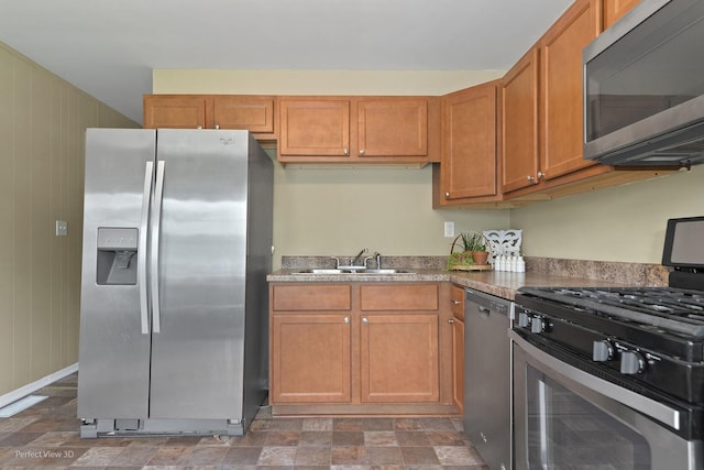 1808 Jethro Ave, Zion, IL 60099 - kitchen featuring appliances with stainless steel finishes and brown cabinetry