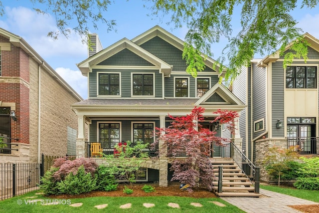 3526 N Hamilton Ave, Chicago, IL 60618 - craftsman-style home with a porch, a chimney, and stone siding