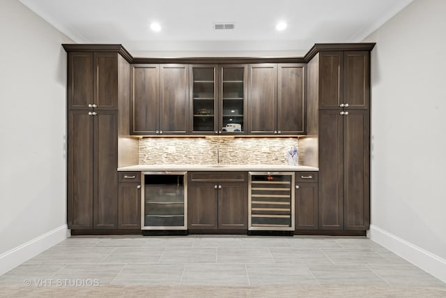 3526 N Hamilton Ave, Chicago, IL 60618 - bar area featuring beverage cooler, backsplash, recessed lighting, and ornamental molding