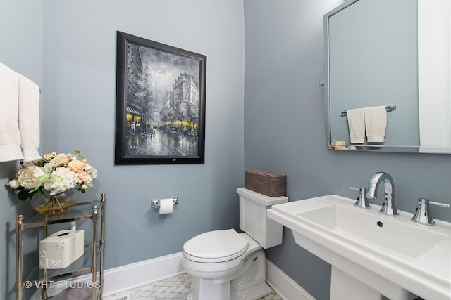 3526 N Hamilton Ave, Chicago, IL 60618 - bathroom with a sink and baseboards
