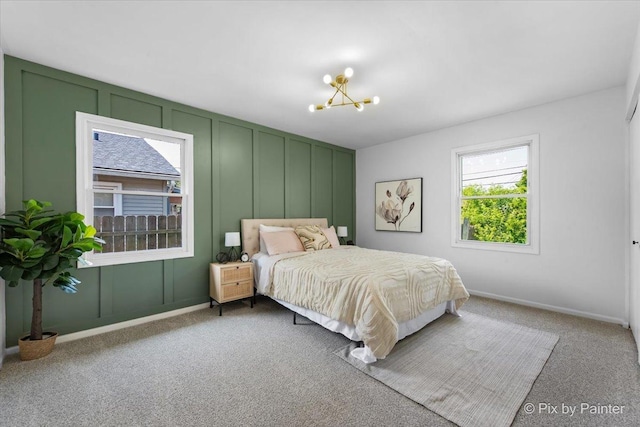 1422 Ridgeway St, Round Lake Beach, IL 60073 - bedroom with a chandelier, carpet floors, and a decorative wall