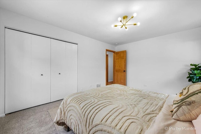 1422 Ridgeway St, Round Lake Beach, IL 60073 - carpeted bedroom featuring a closet and a chandelier