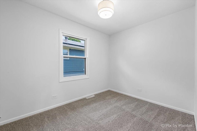 1422 Ridgeway St, Round Lake Beach, IL 60073 - spare room featuring carpet and baseboards
