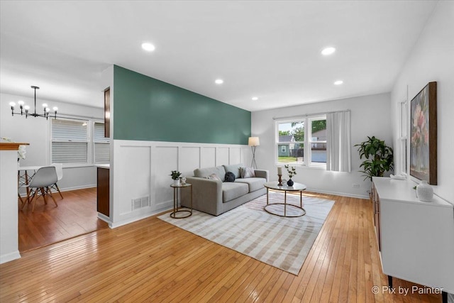 1422 Ridgeway St, Round Lake Beach, IL 60073 - living area featuring light wood-style floors, a chandelier, and recessed lighting